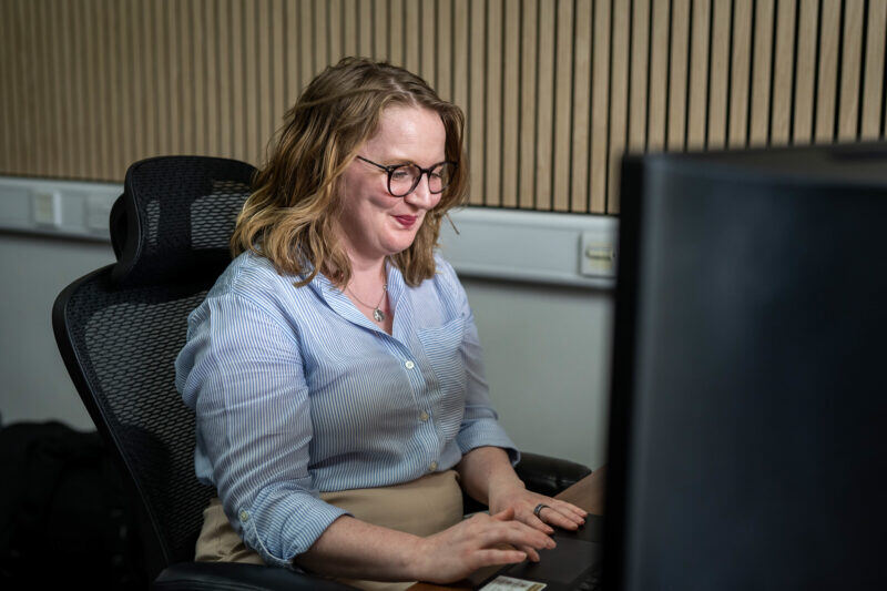 Woman using a computer at a desk