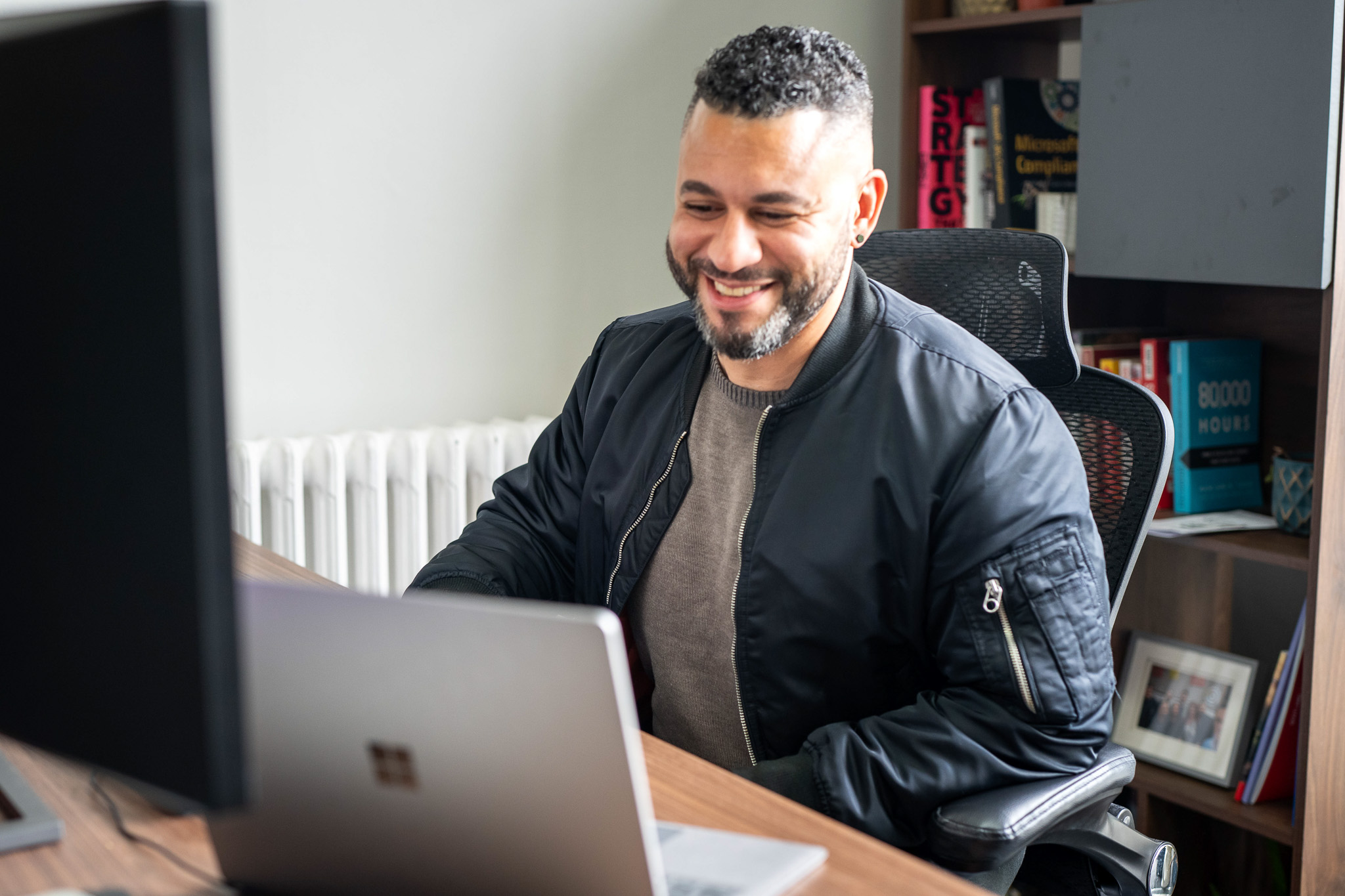 A one-on-one training session using Microsoft Copilot on their laptop.